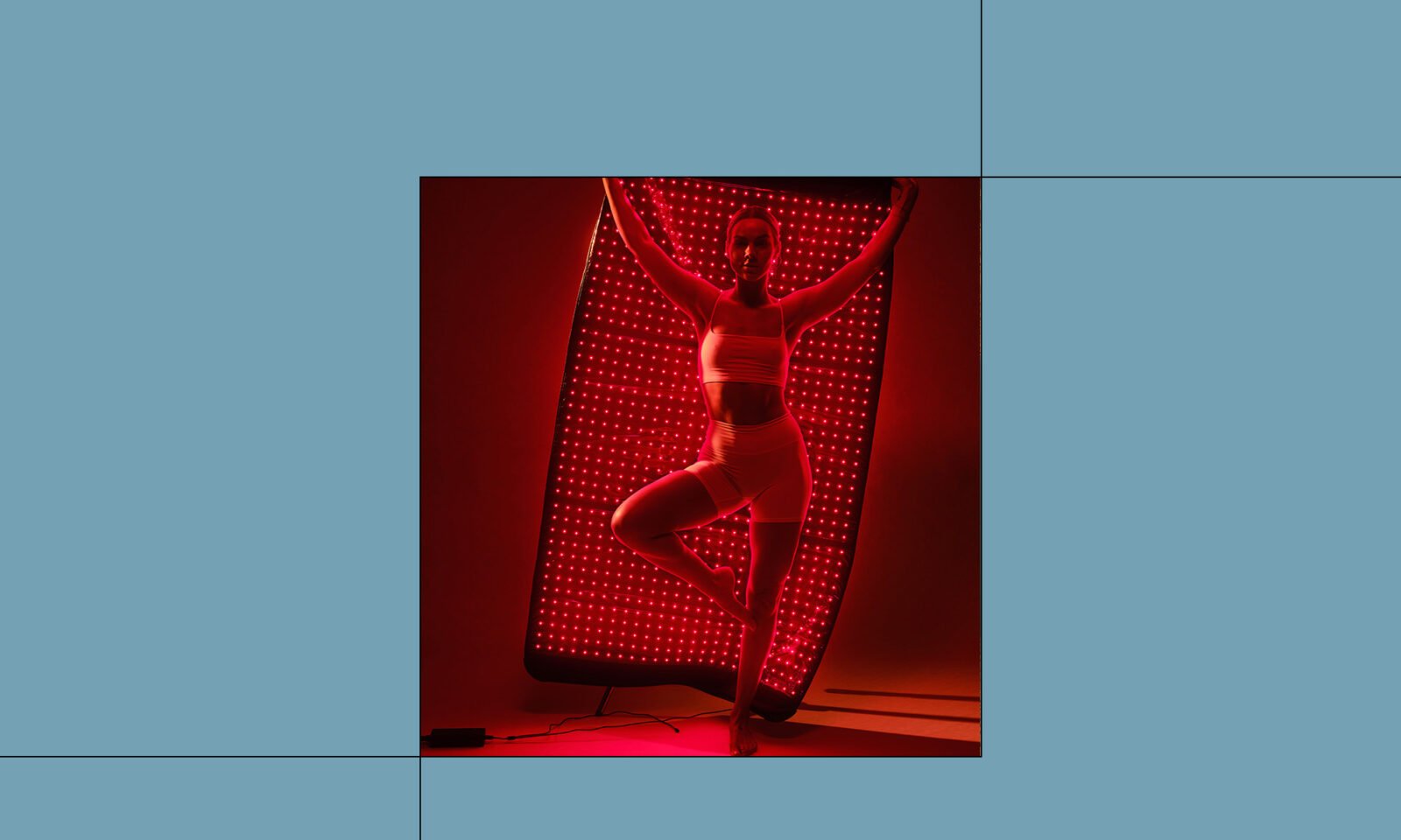 A HigherDOSE Full Body Red Light Mat laid out, possibly with a person relaxing on it or draped over them, showcasing its flexible design.