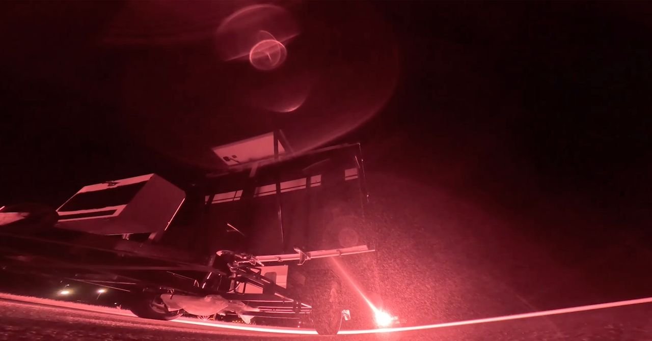 An illustration of a Star Catcher satellite beaming a laser energy beam to another satellite in Earth's orbit, with the sun in the background.