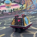 From Imperial Drudge to Rebel Rave: The Autonomous Star Wars Mouse Droid Reimagined 6 Custom 3D-printed Star Wars Mouse Droid with graffiti art, functioning as an autonomous rebel rave machine.