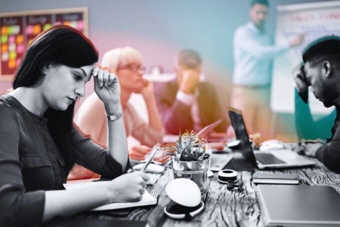 A diverse team collaborating with AI interfaces, symbolizing strategic workforce rebuilding post-layoffs.