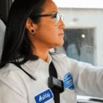 A Walmart truck driver smiling, representing a successful career path without college debt for Gen Z.