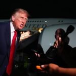 President Donald Trump speaks to reporters on the tarmac before boarding Air Force One, against a backdrop of escalating tensions with the press.