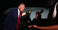 President Donald Trump speaks to reporters on the tarmac before boarding Air Force One, against a backdrop of escalating tensions with the press.