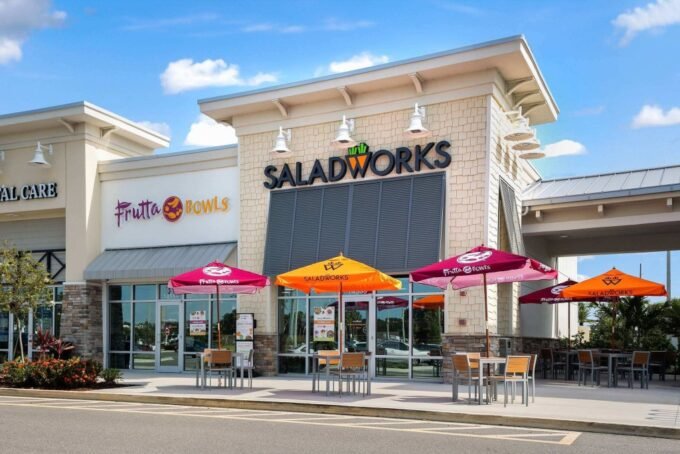 Woworks restaurant storefronts featuring multiple brands like Saladworks and Frutta Bowls under one roof