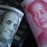 Chinese Yuan banknotes alongside US Dollar bills, symbolizing the global currency landscape.