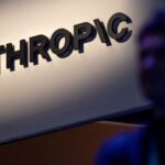 Anthropic logo displayed at a technology summit, symbolizing the company's role in AI development and safety discussions.