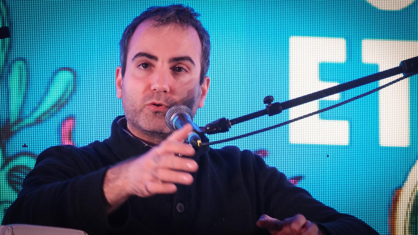 Steven Goldfeder, CEO of Offchain Labs, speaking at ETHDenver 2024, representing Arbitrum's leadership in blockchain innovation.