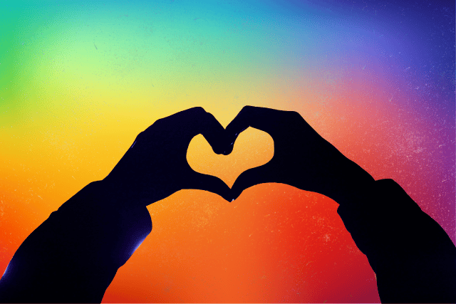 Person standing confidently in a diverse, supportive community, symbolizing self-acceptance and authenticity.