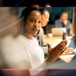 The Unseen Blueprint: How Black Women's Leadership is Shaping the Future of Work 6 Diverse group of professional women collaborating in a modern office setting