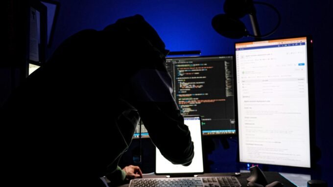 Digital handcuffs on a cryptocurrency symbol, representing the takedown of a crypto fraud network targeting Russian speakers.