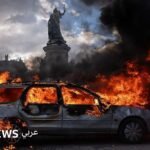 صورة توضيحية للاضطرابات في فرنسا أو سفينة في البحر الأسود أو منشأة طاقة متضررة في أوكرانيا