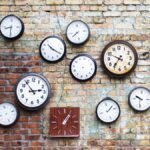 A vintage clock with hands moving, symbolizing the biannual time change for Daylight Saving Time.