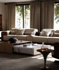 Eureka Ergonomic Arundel Collection modular sofa with warm walnut, tobacco leather, and ivory upholstery, showcasing visible seams.