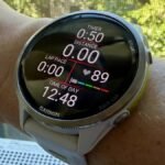 Garmin watch displaying heart rate data and zones on a wrist