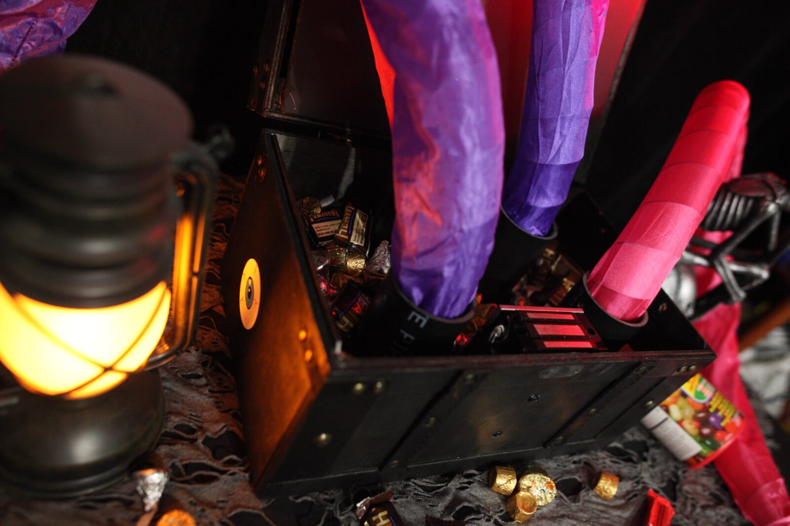 Unleash Spooky Surprises: Craft Your Own Magnet-Activated Halloween Scare Box! 3 A magnet-activated Halloween scare box with its lid snapping open, revealing spring-loaded snakes lunging out.