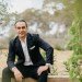 Two professionals shaking hands across a table, symbolizing a successful negotiation, with a subtle background suggesting mental clarity and focus.
