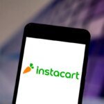 Logos of Instacart, DoorDash, and Uber representing potential merger discussions in the grocery delivery market.