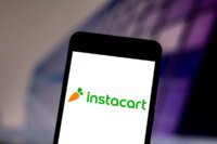 Logos of Instacart, DoorDash, and Uber representing potential merger discussions in the grocery delivery market.