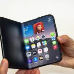 A folded and unfolded view of the new Apple iPhone Duo smartphone, showcasing its dual screens and sleek design.