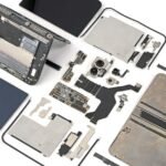 iFixit's detailed teardown of the iPhone Duo, showing its internal components and complex hinge mechanism.
