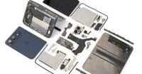 iFixit's detailed teardown of the iPhone Duo, showing its internal components and complex hinge mechanism.