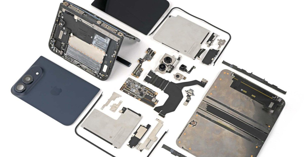 iFixit's detailed teardown of the iPhone Duo, showing its internal components and complex hinge mechanism.