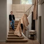 Jeremiah Brent's 'Rhythms of Craft' Collection with Loloi: Architectural Grandeur Meets Tactile Design 8 Jeremiah Brent with the hand-tufted wool Fori rug in Espresso Brown, part of his architectural collection with Loloi.