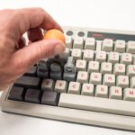 A 3D-printed KeyboaStick joystick attachment replacing WASD keys on a mechanical keyboard, ready for gaming.