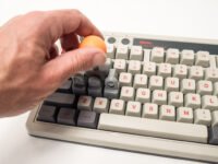 A 3D-printed KeyboaStick joystick attachment replacing WASD keys on a mechanical keyboard, ready for gaming.