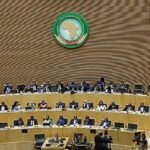 Une image illustrant la coopération sécuritaire, potentiellement avec des logos de l'UA et d'Interpol, ou une carte de l'Afrique symbolisant l'unité.