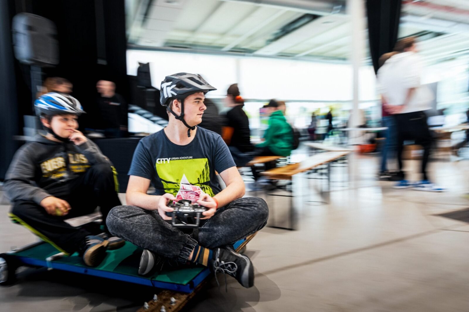 A bustling scene at Maker Faire Brno, showcasing various maker projects and enthusiastic visitors in the Exhibition Halls.