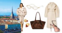 Une femme élégante, le visage partiellement masqué par des lunettes ovales, porte un trench-coat beige fluide et une chemise blanche oversize, avec un sac à bandoulière et des chaussures à plateforme imprimé python, illustrant un style urbain chic.