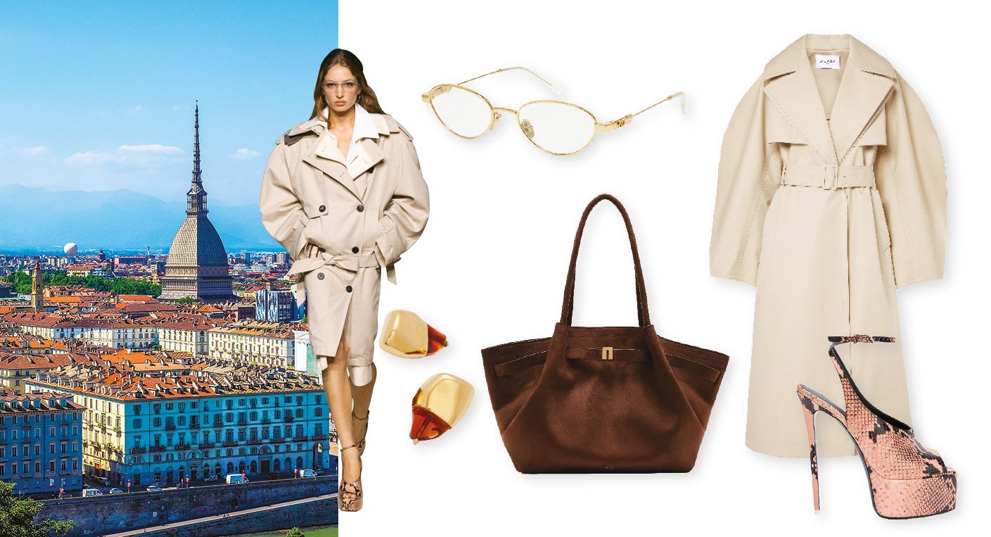 Une femme élégante, le visage partiellement masqué par des lunettes ovales, porte un trench-coat beige fluide et une chemise blanche oversize, avec un sac à bandoulière et des chaussures à plateforme imprimé python, illustrant un style urbain chic.