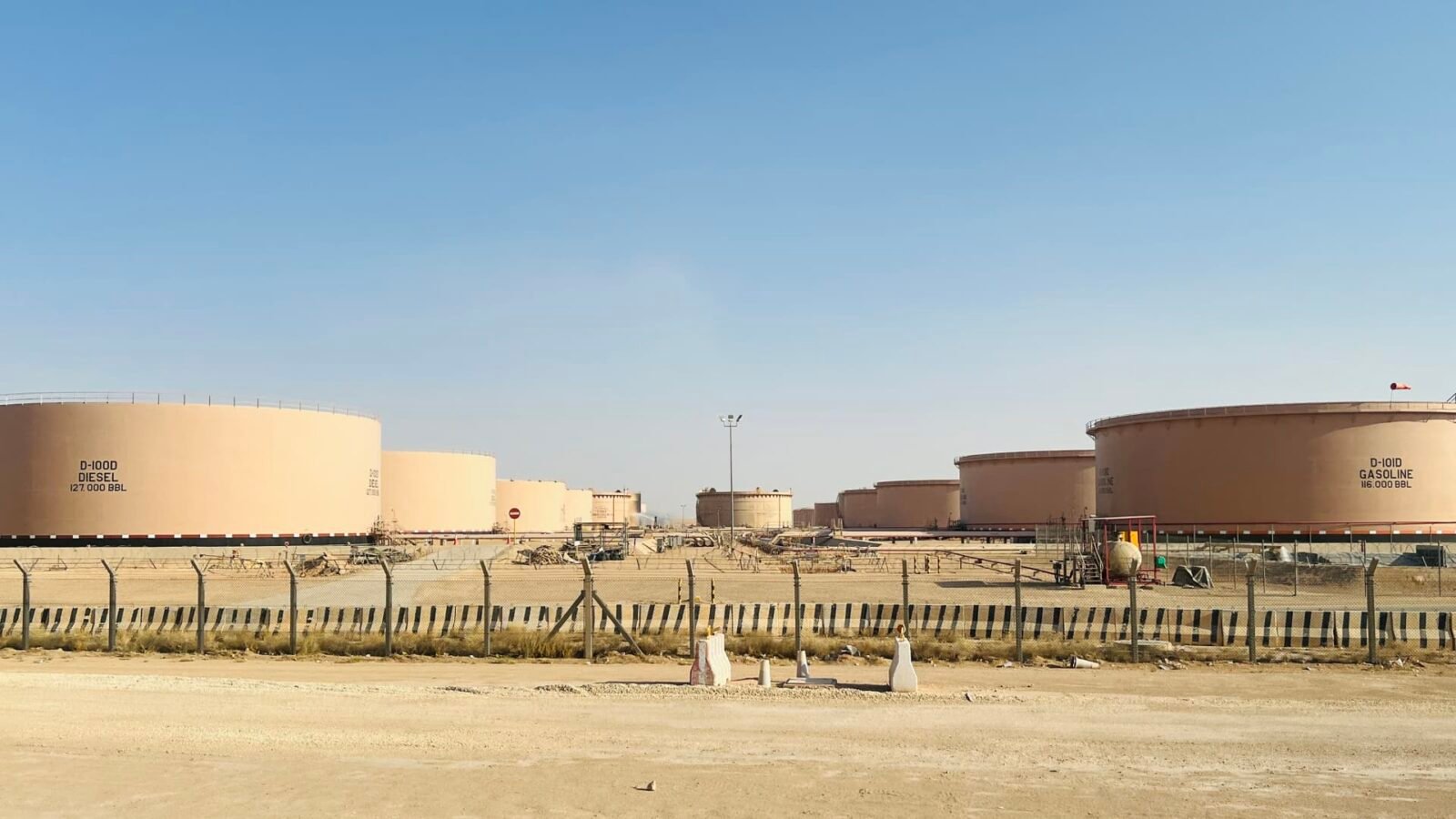 Fuel tanks at a depot, symbolizing global energy supply and the volatility of oil markets.