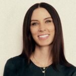 Sarah Gibson Tuttle, founder and CEO of Olive & June, smiling confidently.