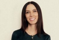 Sarah Gibson Tuttle, founder and CEO of Olive & June, smiling confidently.