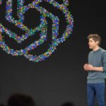 Sam Altman, CEO of OpenAI, speaking at a developer conference, illustrating the company's financial news.