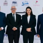 Représentation symbolique de la formation d'une coalition gouvernementale au Maroc, avec les logos des partis PAM, Istiqlal, USFP et PPS.