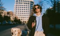 A person walking their dog, symbolizing the connection between pet care and a calm, productive workday.