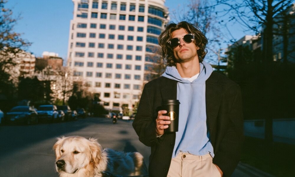 A person walking their dog, symbolizing the connection between pet care and a calm, productive workday.