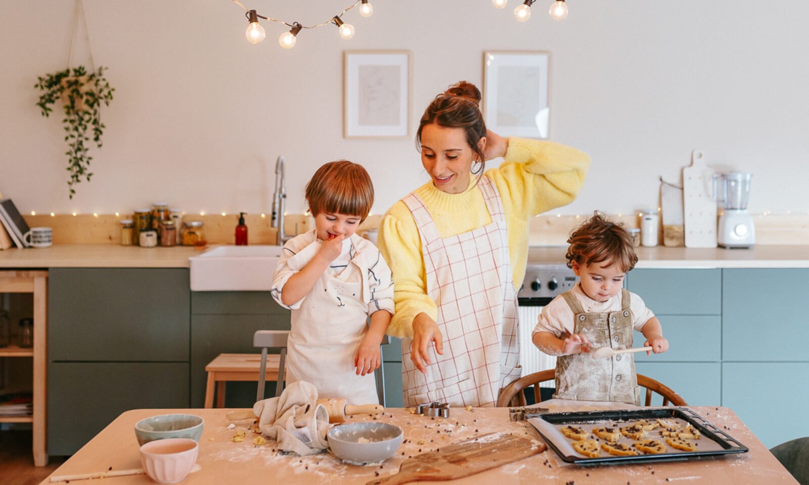 Children playing happily with supportive adults in a bright, safe environment, symbolizing positive childhood experiences.