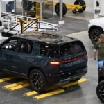 Rivian R2 electric vehicle on display, symbolizing the company's successful Q3 sales and production growth.