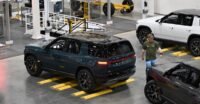 Rivian R2 electric vehicle on display, symbolizing the company's successful Q3 sales and production growth.