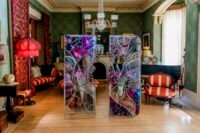 Ry Van Der Hout's 'Open Wing Death' sculpture, a 12-foot ovoid geodesic dome made of mirrored facets, installed in a historic room at Spadina Museum.