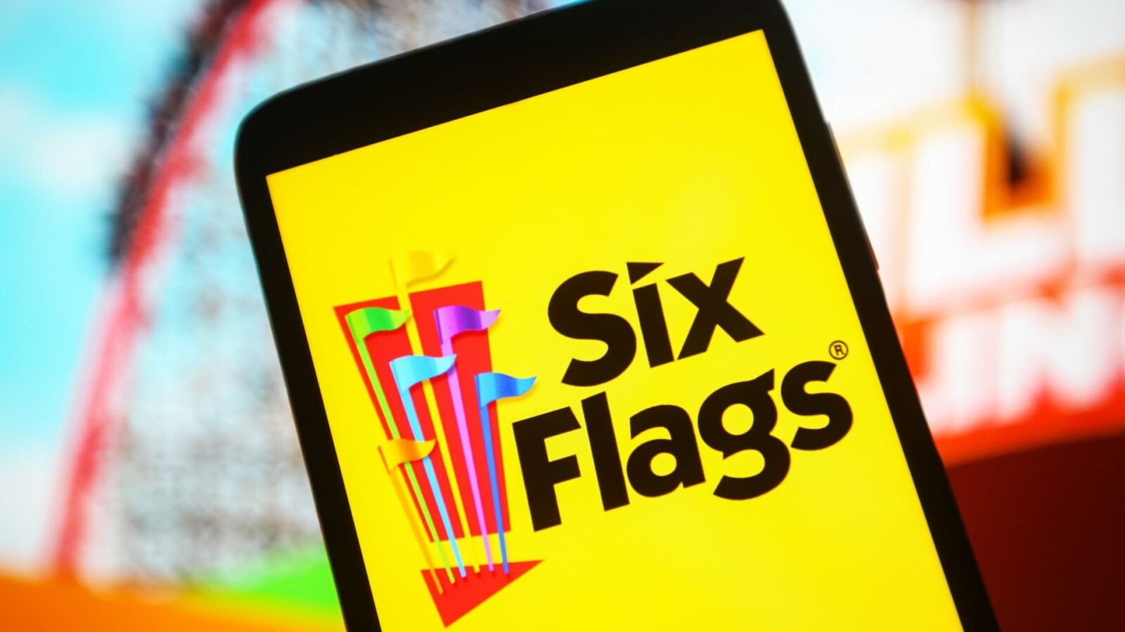 Six Flags Entertainment Corporation logo displayed on a smartphone screen