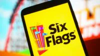 Six Flags Entertainment Corporation logo displayed on a smartphone screen