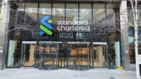 Standard Chartered building in Dubai, symbolizing institutional finance and digital asset innovation.