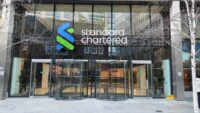 Standard Chartered building in Dubai, symbolizing institutional finance and digital asset innovation.