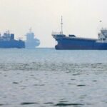 Wreckage of the GFS Pride container ship in the Strait of Hormuz after an attack