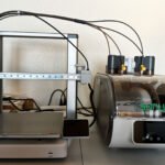 Sunlu AMS Lite Filament Heater integrated with a Bambu Lab AMS Lite unit, showing filament spools inside.
